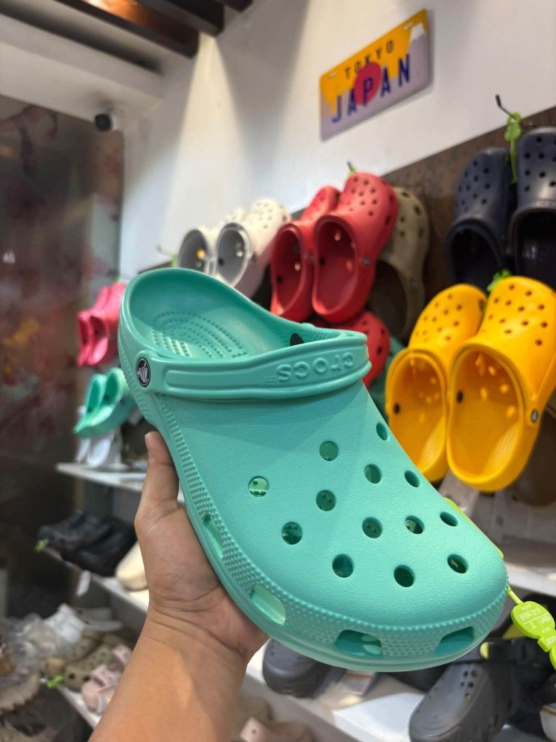 Crocs Classic Clog Sandals Various Colors (Category: Slippers and slides) located in Cebu City. Submitted by madeskartegirl (Listing ID 1466786229, Image 3). Description: - Available Colors: Red, Mint Green, and Yellow - Iconic ventilation ports add breathability and shed water - Pivoting heel straps for a more secure fit - Incredibly lightweight and fun to wear - Water-friendly and buoyant (great for everyday casual use).