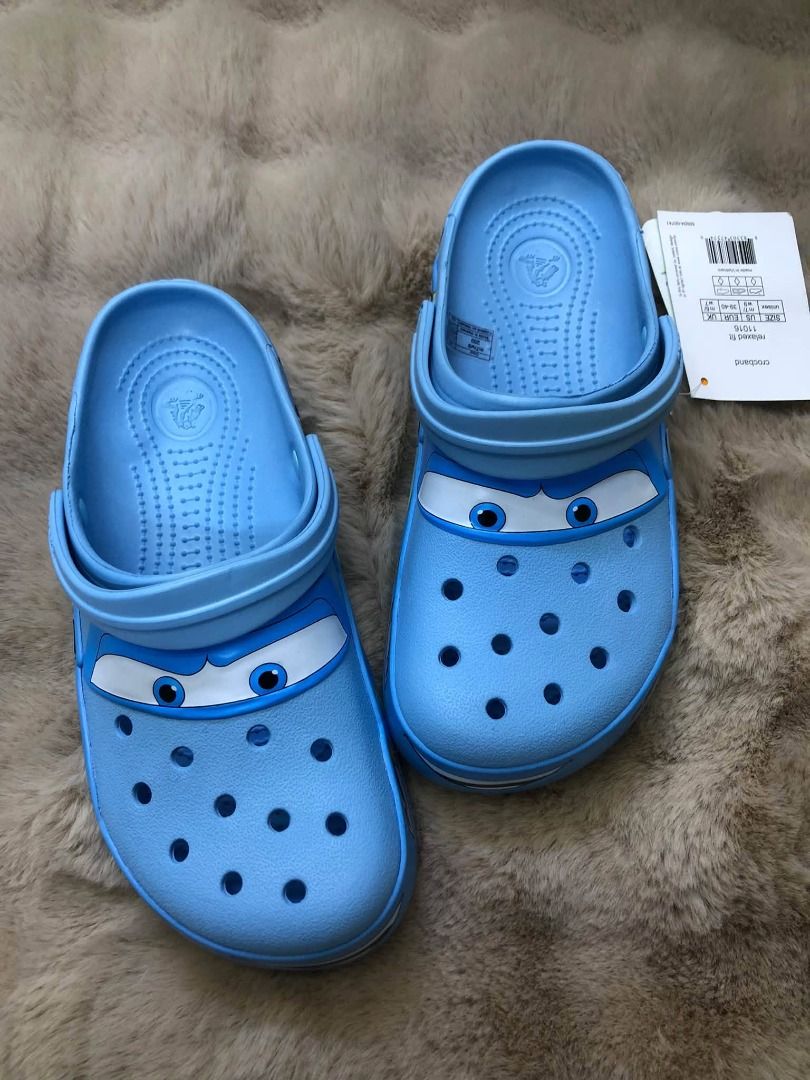 Crocs Lightning McQueen Cars Clogs Blue (Category: Slippers & Slides) located in Manila. Submitted by khielnatha93179 (Listing ID 1466795775, Image 2). Description: - Authentic quality / top grade - Size : 36 to 45 - Brand: Disney Cars Lightning McQueen Crocs - Color: Light blue with fun character eyes printed on front - Condition: Brand new with original store tag attached - Comfort: Breathable ventilation holes and relaxed fit style - Fit: Secu