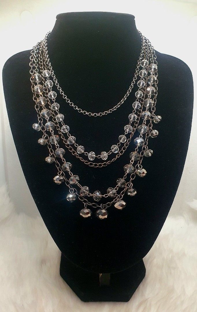 Crystal Beaded Multi-Strand Statement Necklace with Gunmetal Chains (Category: Necklaces) located in San Juan City. Submitted by loulous_boutique_manila (Listing ID 1466920842, Image 1). Description: 🌸 Multi-strand layered design for a full, draped look 🌸 Gunmetal-toned chains paired with sparkling faceted clear crystals 🌸 Dangling glass bead charms on lower tiers 🌸 Length of Necklace Layers: 1st Layer: 16 inches 2nd Layers: 18 inches 3rd Lay