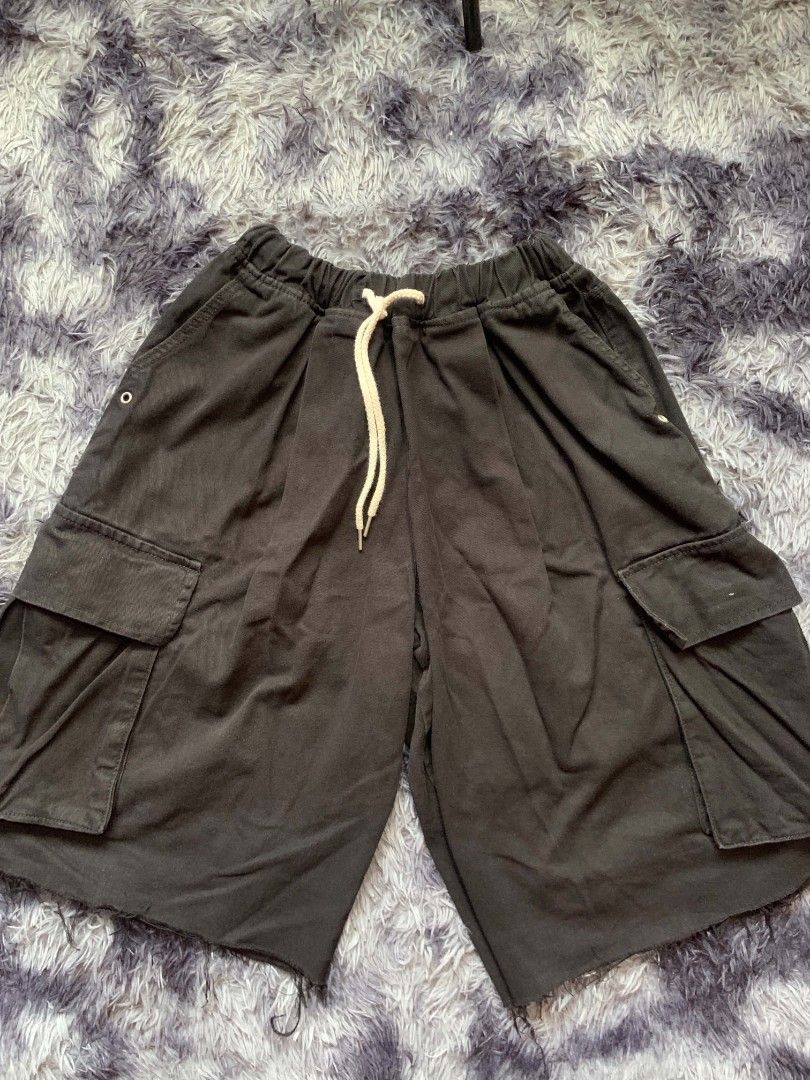 Cullavo Black Cargo Shorts with Drawstring (Category: Shorts) located in Pagadian. Submitted by duskthrift (Listing ID 1466857196, Image 1). Description: - Brand: Cullavo - Size: F - Material: 100% cotton, Made in Korea - Color: Black - Waistband: Elastic with thick cream drawstring - Pockets: Large side cargo pockets and back pockets - Details: Casual raw frayed hem - Style: Super comfortable streetwear piece.