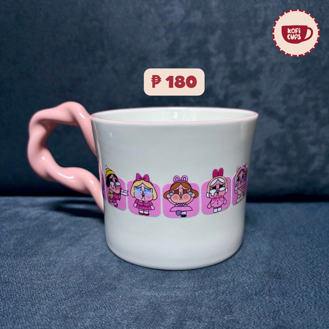 Cute Pink Character Ceramic Coffee Mug with Twisted Handle (Category: Coffee & Tea Tableware) located in General Trias. Submitted by dddddaph (Listing ID 1466839259, Image 1). Description: Playful twisted pink handle design LOCATION: General Trias City, Cavite MOD: Lalamove/ J&T 📌 Please Read Before Ordering: * These are factory pull-out mugs, so minor imperfections may be present. * Rest assured that any noticeable flaws, such as cracks or chip