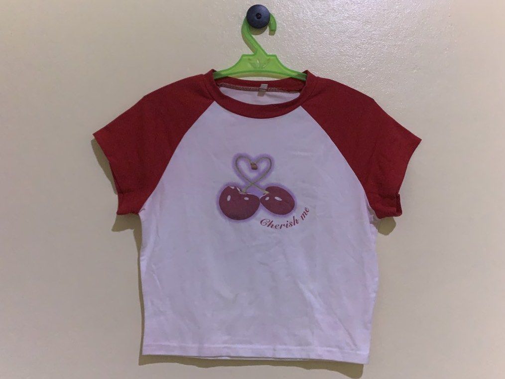 Y2k red cherry crop top size M (Category: Blouses) located in Taguig. Submitted by liandeclutters (Listing ID 1466875735, Image 1). Description: flaw: super cute top but it has a pink stain (not that visible) cos nahaluan siya ng another colored top during laundry 📍Taguig City.