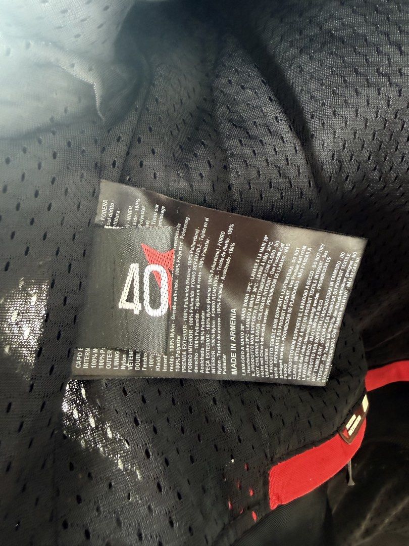 Dainese Black Textile Motorcycle Jacket Size 40 (Category: Coats, Jackets and Outerwear) located in Taguig. Submitted by JBT1968 (Listing ID 1466927483, Image 3). Description: - Authentic Dainese textile motorcycle jacket in Black - Size: 40 (Made in Armenia) - Full zip front with red Dainese logo embroidery on chest - Large reflective demon logo patch on the back for night visibility - Multiple zipper vents on front and arms for airflow - Adjust