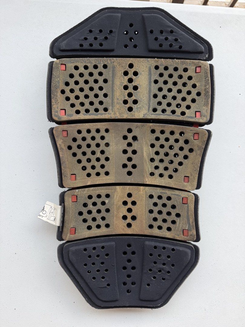 Dainese G.2 Wave Back Protector Armor (Category: Braces, Support & Protection) located in Taguig. Submitted by JBT1968 (Listing ID 1466928934, Image 2). Description: - Authentic Dainese Wave G.2 back protector insert - Standard G2 size, fits most compatible motorcycle jackets - Black outer shell featuring the iconic red Dainese logo - Perforated design ensures great airflow across the spine - Inner foam has yellowed due to age, but structural int