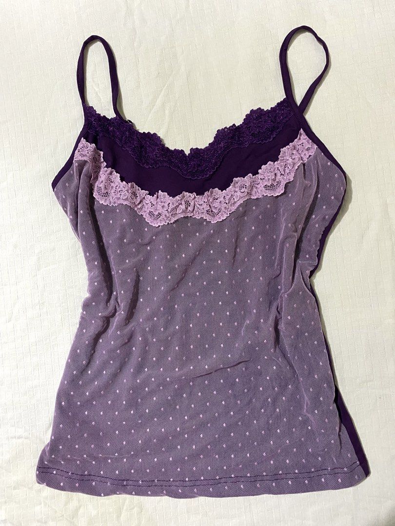 Dazy Purple Lace Trim Dot Mesh Cami Size M (Category: Sleeveless) located in Quezon City. Submitted by getitrightaway.ph (Listing ID 1466847824, Image 1). Description: - Brand: Dazy - Size: Medium (tag on collar) - Color: Purple with light lavender accents - Design: Mesh overlay with all-over polka dots, dark purple lace neckline, and light lavender lace ruffle - Features: Adjustable thin shoulder straps, smooth solid purple back, and stretchy ma