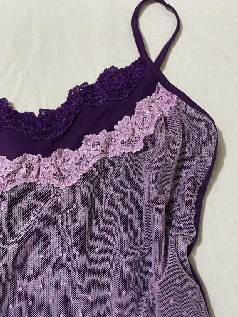 Dazy Purple Lace Trim Dot Mesh Cami Size M (Category: Sleeveless) located in Quezon City. Submitted by getitrightaway.ph (Listing ID 1466847824, Image 3). Description: - Brand: Dazy - Size: Medium (tag on collar) - Color: Purple with light lavender accents - Design: Mesh overlay with all-over polka dots, dark purple lace neckline, and light lavender lace ruffle - Features: Adjustable thin shoulder straps, smooth solid purple back, and stretchy ma