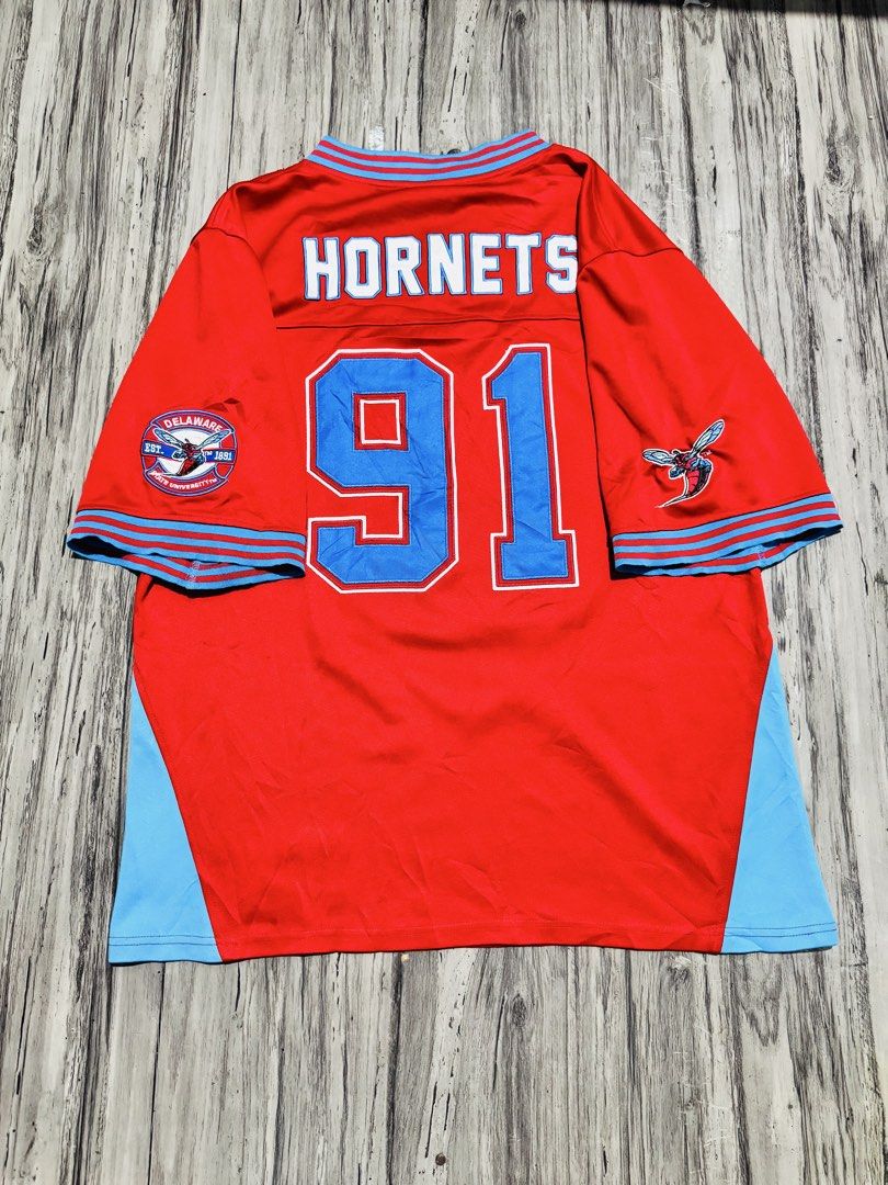 Delaware State University Hornets #91 Jersey Red Blue (Category: Activewear) located in Quezon City. Submitted by lucky_wisefish.2ca7d6 (Listing ID 1466965778, Image 2). Description: - Authentic Delaware State University Hornets jersey in striking red and light blue - Number 91 prominently displayed on the front and back - 'Hornets' lettering across the upper chest and back shoulders - Embroidered hornet mascot patches on both sleeves - Classic s