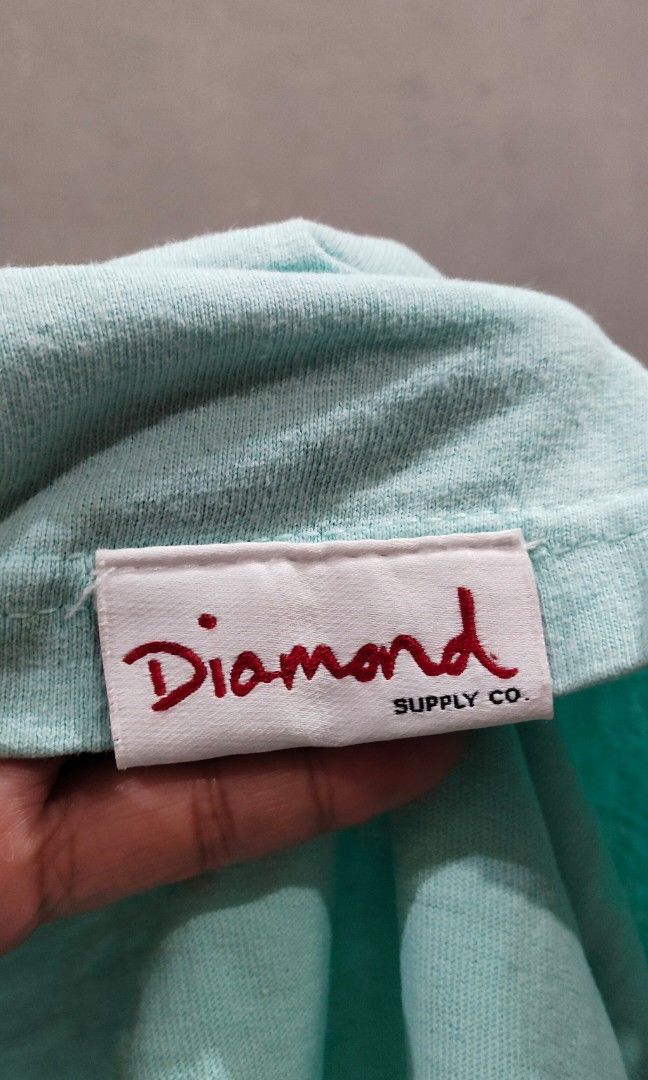Diamond Supply Co. (Category: Coats, Jackets and Outerwear) located in Manila. Submitted by yheen_shark (Listing ID 1466800035, Image 2). Description: Diamond Supply Co. T-Shirt AUTHENTIC DIAMOND SUPPLY CO. T-Shirt — XL Description: ✅ BRAND: Diamond Supply Co. — US Streetwear Brand 🇺🇸 ✅ Color: Light Mint / Baby Blue ✅ Size: XL — Oversized fit ✅ Material: 100% Cotton — makapal, malambot, at matibay ✅ Condition: Gently used — malinis, walang buta
