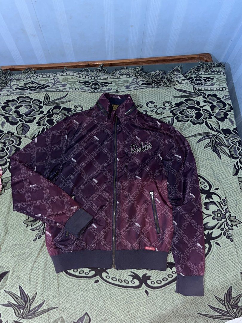 Dickies FW22 Patterned Zip-Up Jacket Maroon Purple (Category: Coats, Jackets and Outerwear) located in Manila. Submitted by coybns (Listing ID 1466923727, Image 2). Description: - Brand: Dickies (FW22 Collection) - Design: All-over monogram pattern in maroon and purple - Details: High mock neck, ribbed cuffs and hem, full metal zipper - Branding: Embroidered Dickies logo script on left chest - Pockets: Dual front zippered pockets - Style: Streetw
