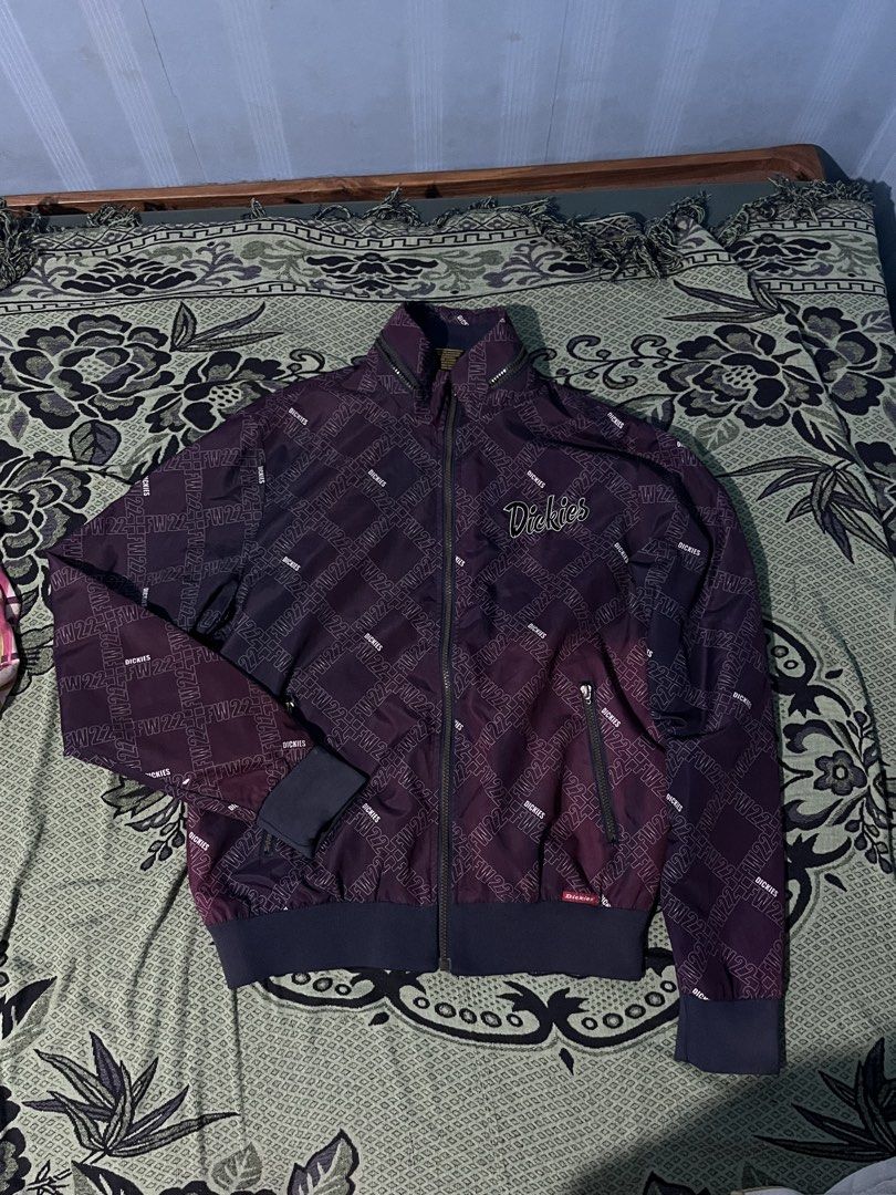 Dickies FW22 Patterned Zip-Up Jacket Maroon Purple (Category: Coats, Jackets and Outerwear) located in Manila. Submitted by coybns (Listing ID 1466923727, Image 1). Description: - Brand: Dickies (FW22 Collection) - Design: All-over monogram pattern in maroon and purple - Details: High mock neck, ribbed cuffs and hem, full metal zipper - Branding: Embroidered Dickies logo script on left chest - Pockets: Dual front zippered pockets - Style: Streetw