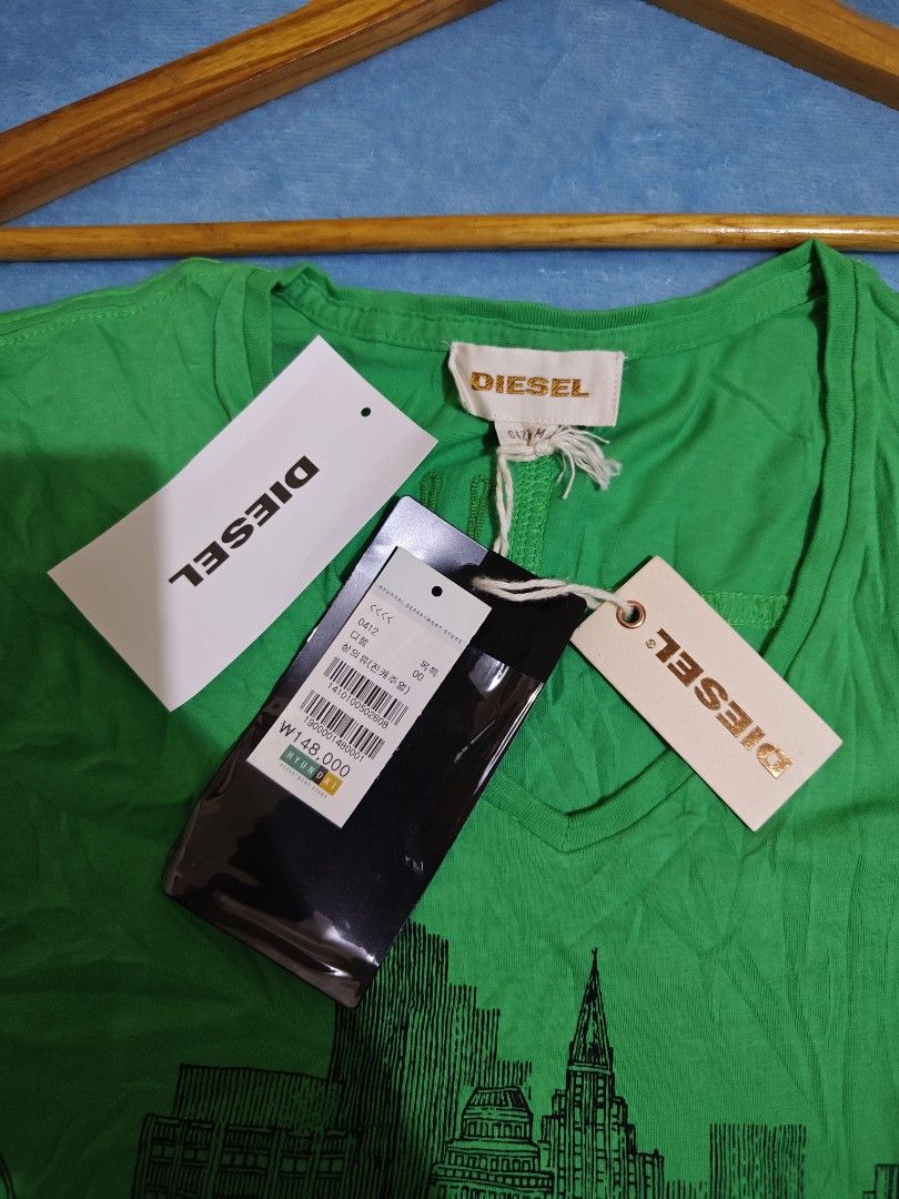 Diesel (Category: Luxury Apparel) located in Mandaue City. Submitted by prekfinds (Listing ID 1466900890, Image 3). Description: Diesel V-neck graphic tshirt Brandnew condition W/hangtag pa yarnn 10/10colorate Size:Medium Dimes: 19W x 28L No issue.