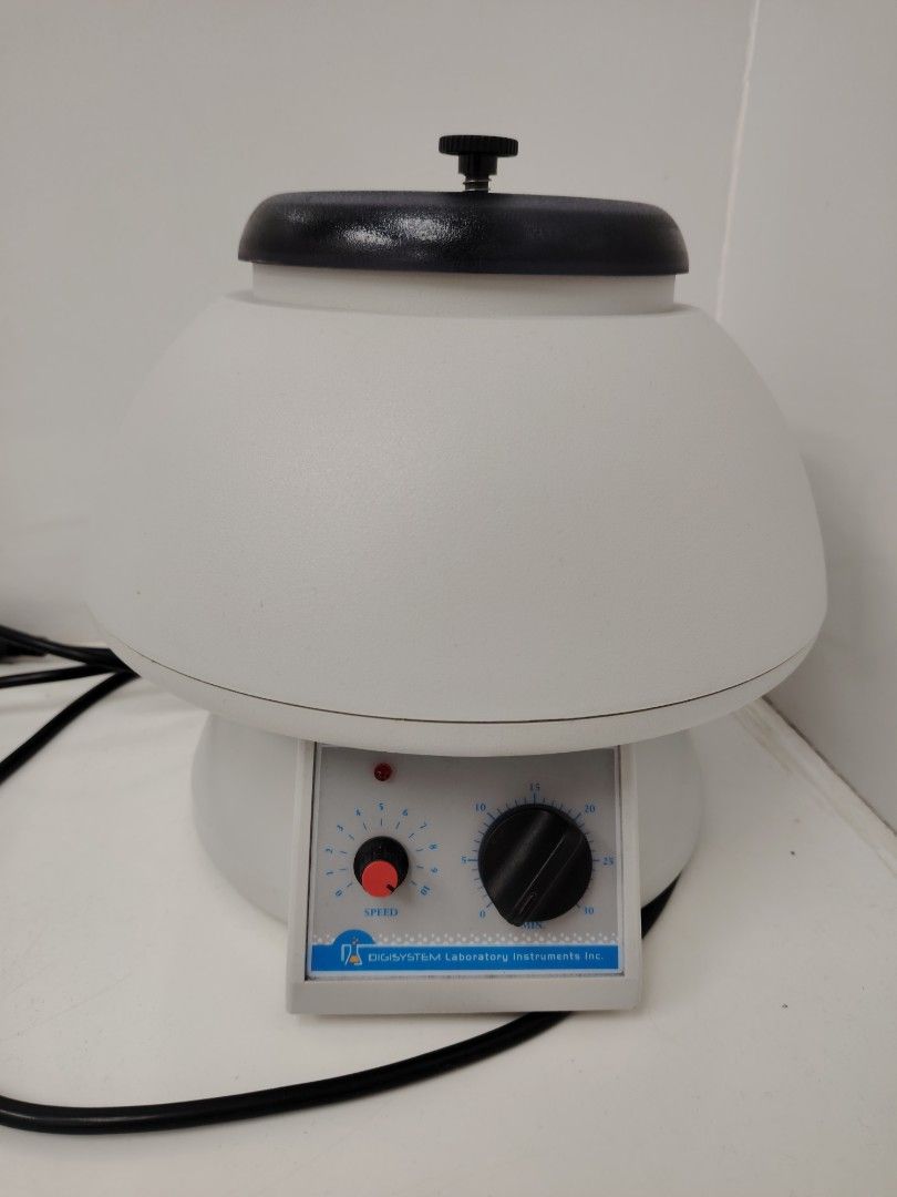 Digisystem Laboratory Instruments Inc. Centrifuge Machine (Category: Medical Supplies & Tools) located in Muntinlupa City. Submitted by zenalie_06 (Listing ID 1466810612, Image 1). Description: - Brand: Digisystem - Type: Laboratory centrifuge equipment - Color: White body with black lid and control knobs - Controls: Speed dial on the left, 30-minute timer dial on the right - Indicators: Power indicator light in the center - Included: Attached bl