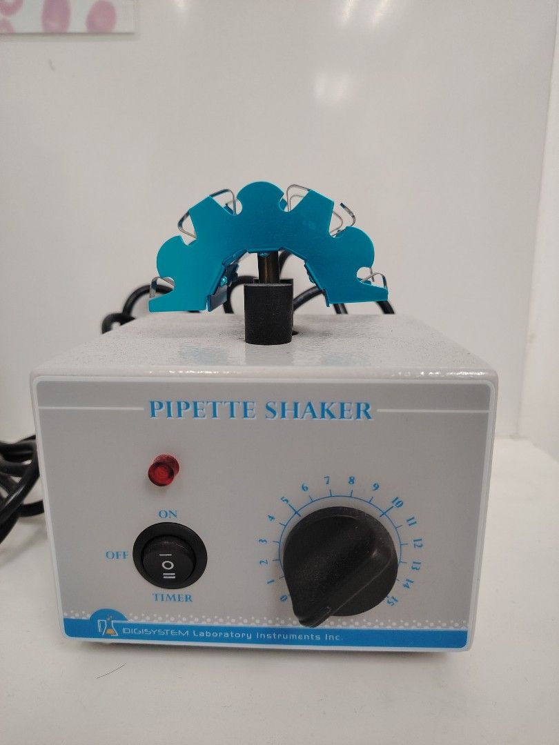 Digisystem Laboratory Instruments Pipette Shaker (Category: Medical Supplies & Tools) located in Muntinlupa City. Submitted by zenalie_06 (Listing ID 1466812374, Image 1). Description: - Brand: Digisystem Laboratory Pipette Shaker - Condition: Clean exterior with minor signs of handling, powers on and works well - Design: Grey body with a vibrant blue top attachment - Controls: On/off/timer switch and speed dial (numbered up to 15) - Power: Comes