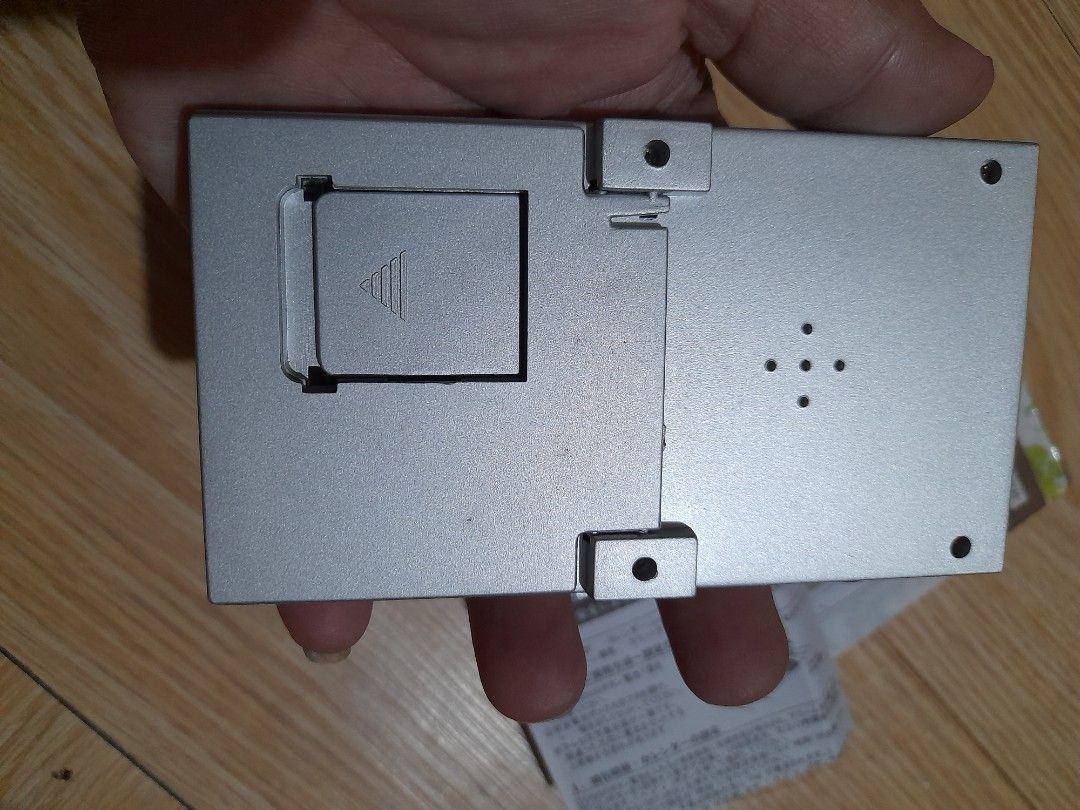 Digital Calendar and Clock with Thermometer (Category: Clocks) located in Bocaue. Submitted by marajapansurplus (Listing ID 1466888226, Image 3). Description: - Color: Silver and white - Display: Clear LCD showing time, date, day of the week, and room temperature - Design: Compact desk size with easy-to-use front panel buttons - Power: Battery-operated (compartment at the back) - Inclusions: Comes with original box and instruction manual.