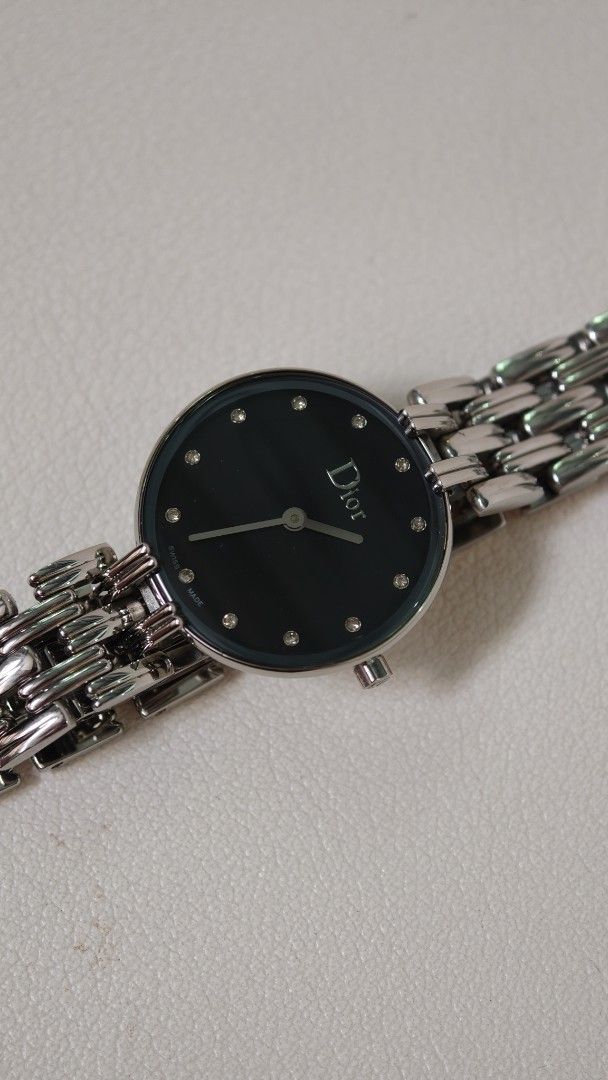 Dior Black Dial Silver Tone Ladies Watch (Category: Women's Watches) located in Mandaluyong City. Submitted by sirmeal (Listing ID 1466821307, Image 1). Description: Prelove but good as new unit only n ordinary watch box Christian Dior watch - Elegant black dial with silver hands and sparkling crystal markers - Silver-tone link bracelet with secure butterfly clasp closure - Signature CD logo engraved on the crown - Case back features official Chr