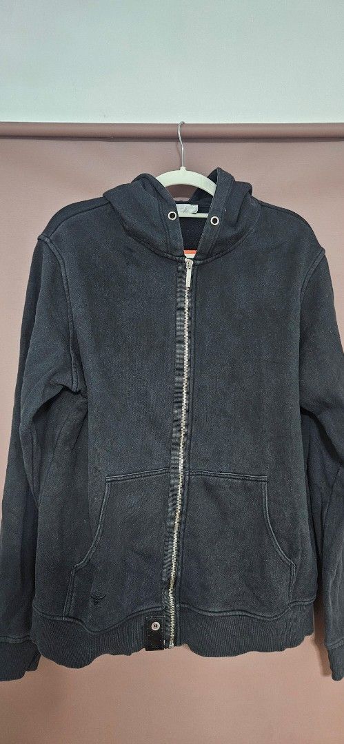 Dior Black Zip-Up Hoodie (Category: Hoodies) located in Santa Maria. Submitted by rommelmateo (Listing ID 1466946623, Image 1). Description: Dior black zip-up hoodie with front pockets. Has a bee embroidery detail on the sleeve and a branded leather tag at the bottom hem with a button closure. Ribbed cuffs and hem. Full zip front with hood. Washed black look with some fading and wear..