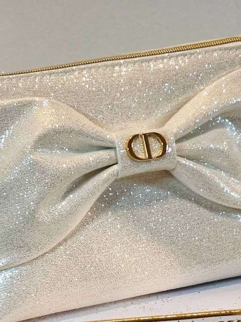 Dior Glitter Bow Pouch (Category: Luxury Bags & Wallets) located in Taytay. Submitted by angeltyyyy (Listing ID 1466808318, Image 2). Description: selling this authentic complimentary gift from Dior: cosmetic pouch, holiday release! ang nice din nito for christmas szn ✨ for pre order, arriving next next week (DP required: ₱500) loc: taytay, rizal (can also ship from QC and Pasay, depending on sched 💗).