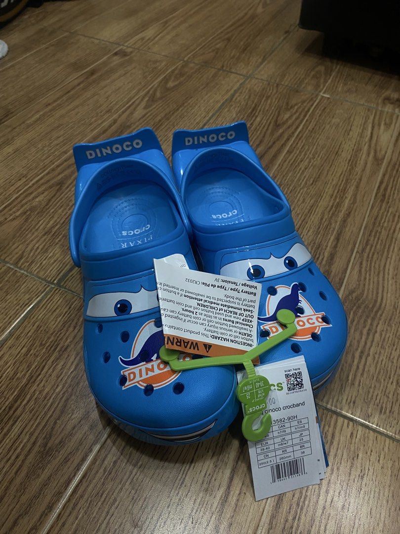 Disney Pixar Dinoco Lightning McQueen Crocs (Category: Sneakers) located in Manila. Submitted by evangelist33391 (Listing ID 1466778801, Image 3). Description: - Brand: Disney Pixar Dinoco Edition Crocs - Condition: Brand new, unworn with original store tags - Color: Bright blue (Lightning McQueen rival theme) - Design: Graphic details including toe box eyes, Dinoco logos, and #95 numbering - Feature: Unique spoiler back strap ON HAND US 7M 9W.