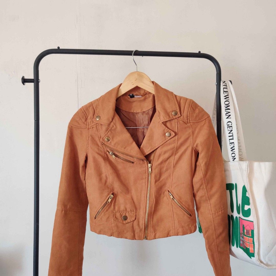 DIVIDED by H&M brown suede biker jacket (Category: Coats, Jackets and Outerwear) located in Manila. Submitted by swishyyy (Listing ID 1466834042, Image 1). Description: - brandnew/ worn once - Brand: Divided by H&M - Material: Brown faux suede (warm caramel tone) - Style: Classic motorcycle / biker jacket - Details: Asymmetrical front zipper, zipped pockets, metallic collar and lapel buttons, lined interior - Fit: Cropped cut with structured shou