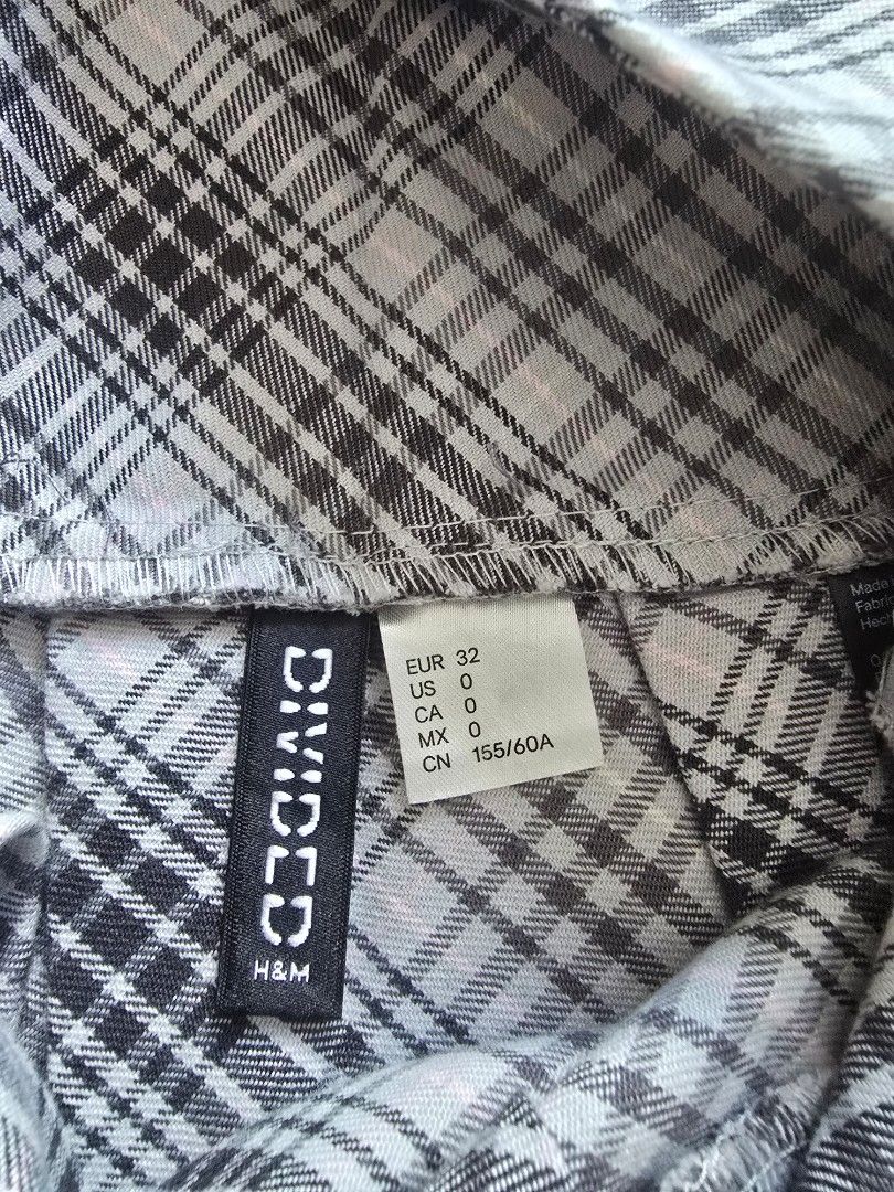 Divided by H&M Pleated Checkered Skirt (Category: Skirts) located in Manila. Submitted by mibellascloset (Listing ID 1466797230, Image 2). Description: take all for 500 - Brand: Divided by H&M - Design: Classic black and white plaid pattern - Style: Pleated, short length, schoolgirl aesthetic - Size: EUR 32 - Closure: Convenient side zipper - Material: Lightweight and easy to style - Condition: Wardrobe clear-out piece, perfect to pair with overs