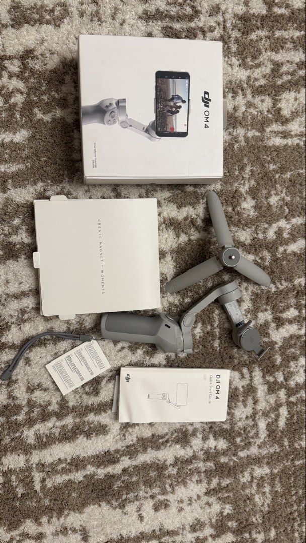 DJI OM 4 Smartphone Stabilizer Gimbal (Category: Gimbals & Stabilizers ) located in Makati City. Submitted by declutter_forsale (Listing ID 1466918855, Image 2). Description: - Model: DJI OM 4 Smartphone Stabilizer (Grey finish) - Rarely use, in very good condition fully functional - Features: Quick-snap magnetic phone clamp for instant setup - Condition: Great working condition, complete with original packaging - Inclusions: Tripod stand for sta
