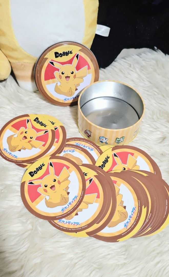 DOBBLE POKÉMON CARD GAME (Category: Other Merchandise) located in Manila. Submitted by yourfavoritethings7 (Listing ID 1466932976, Image 1). Description: circular card - 55 pcs Tin can cover - with tape marks.