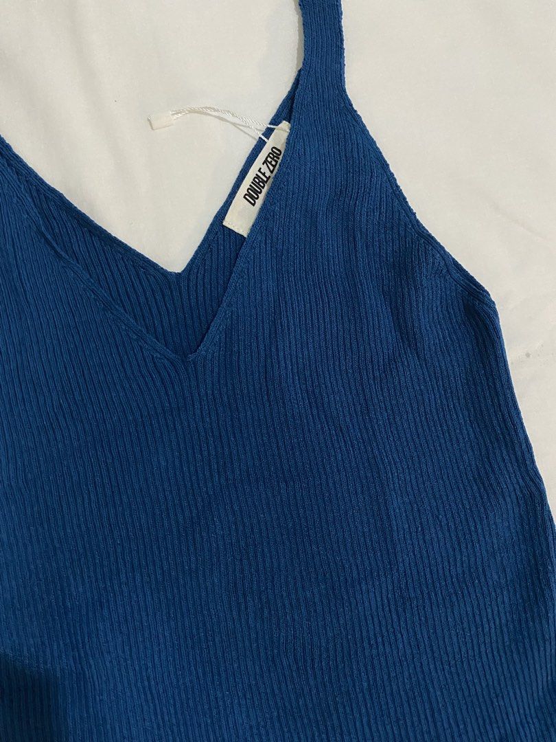 Double Zero Blue Ribbed Tank Top (Category: Sleeveless) located in Tabaco. Submitted by camila_p (Listing ID 1466779128, Image 2). Description: - Brand: Double Zero - Size: Small (S) - Condition: Brand new with tags attached - Color: Bright blue - Material: Stretchy knit fabric - Details: V-neck cut with thick straps and ribbed texture.