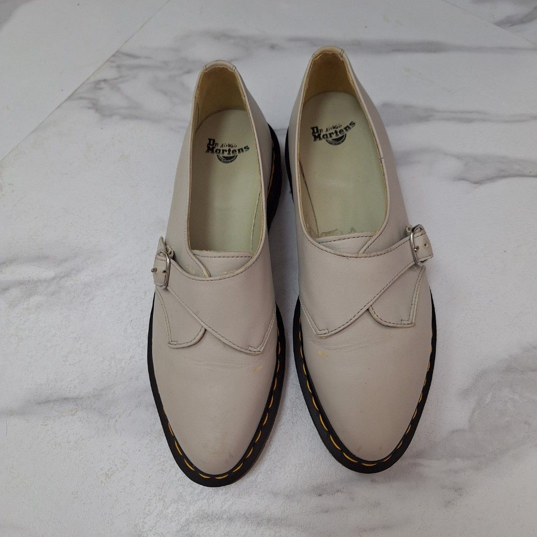 Dr. Martens Agnes Pointed Monk Flat / Oxford (Category: Loafers) located in Taguig. Submitted by moreken1985 (Listing ID 1466797780, Image 2). Description: - Brand: Dr. Martens - Style: Monk strap shoes in off-white leather - Soles: Black air-cushioned soles with classic yellow welt stitching - Details: Adjustable front buckle strap and light cream interior lining with branded insoles - Condition: Slight wear spots on the upper leather; soles hav