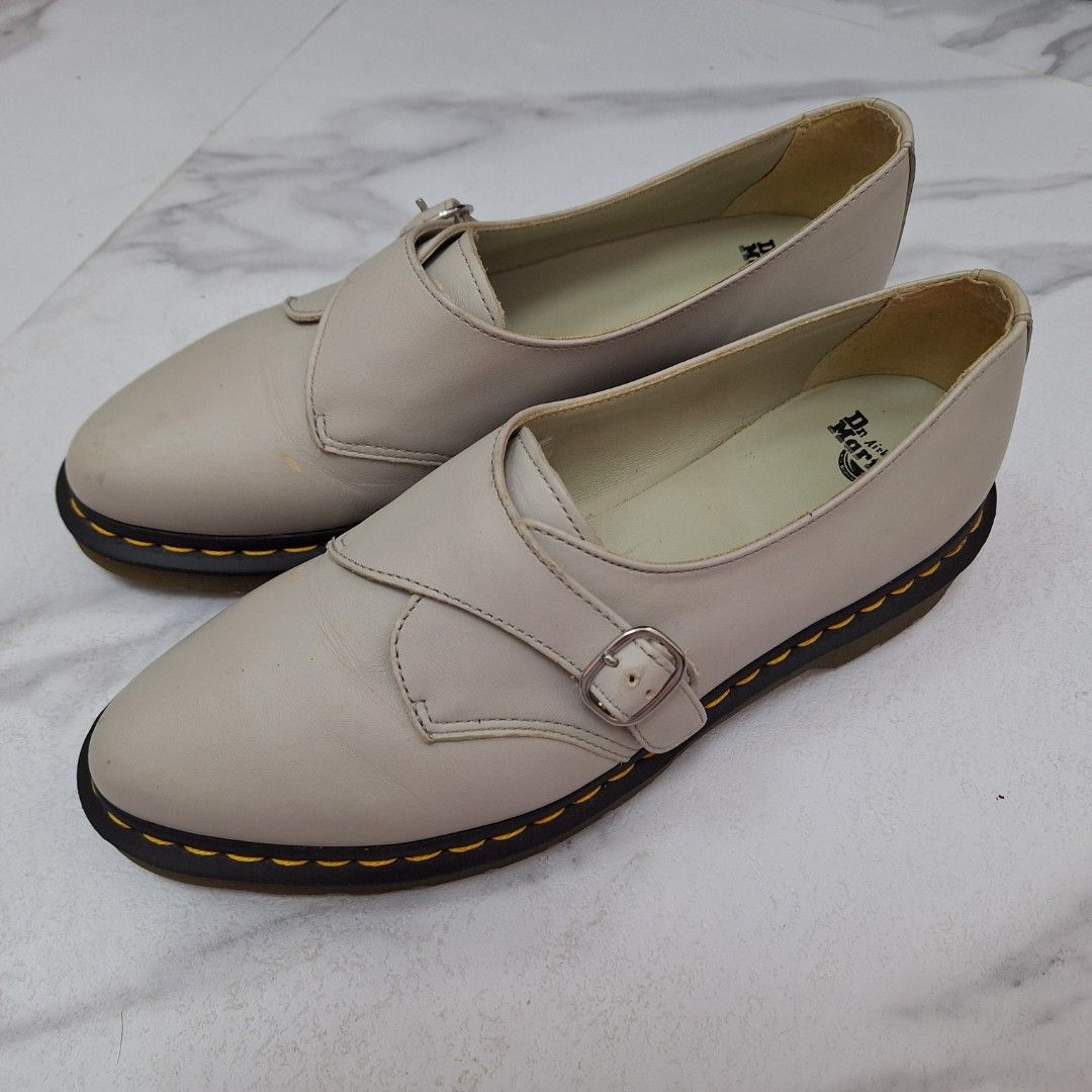 Dr. Martens Agnes Pointed Monk Flat / Oxford (Category: Loafers) located in Taguig. Submitted by moreken1985 (Listing ID 1466797780, Image 3). Description: - Brand: Dr. Martens - Style: Monk strap shoes in off-white leather - Soles: Black air-cushioned soles with classic yellow welt stitching - Details: Adjustable front buckle strap and light cream interior lining with branded insoles - Condition: Slight wear spots on the upper leather; soles hav