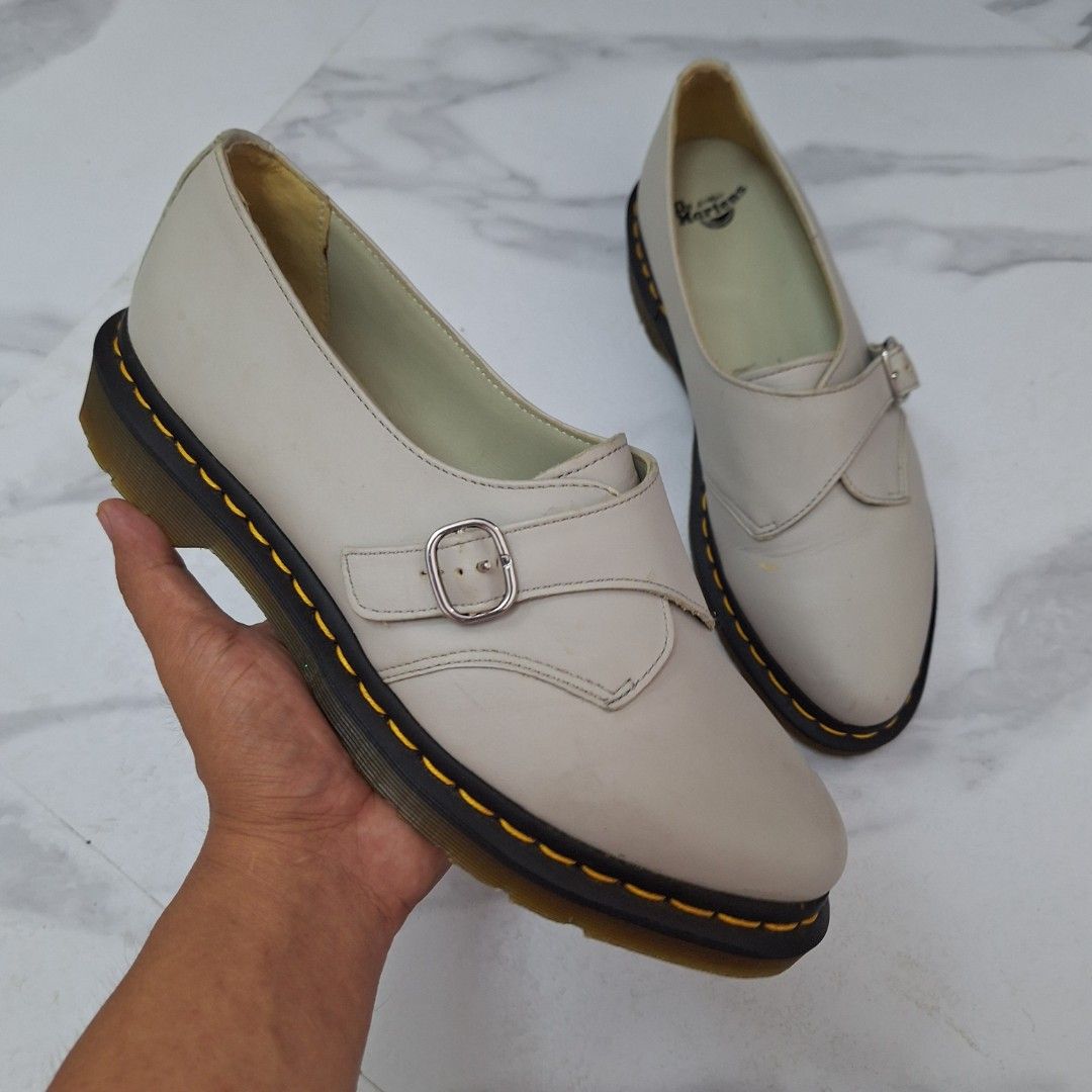 Dr. Martens Agnes Pointed Monk Flat / Oxford (Category: Loafers) located in Taguig. Submitted by moreken1985 (Listing ID 1466797780, Image 1). Description: - Brand: Dr. Martens - Style: Monk strap shoes in off-white leather - Soles: Black air-cushioned soles with classic yellow welt stitching - Details: Adjustable front buckle strap and light cream interior lining with branded insoles - Condition: Slight wear spots on the upper leather; soles hav