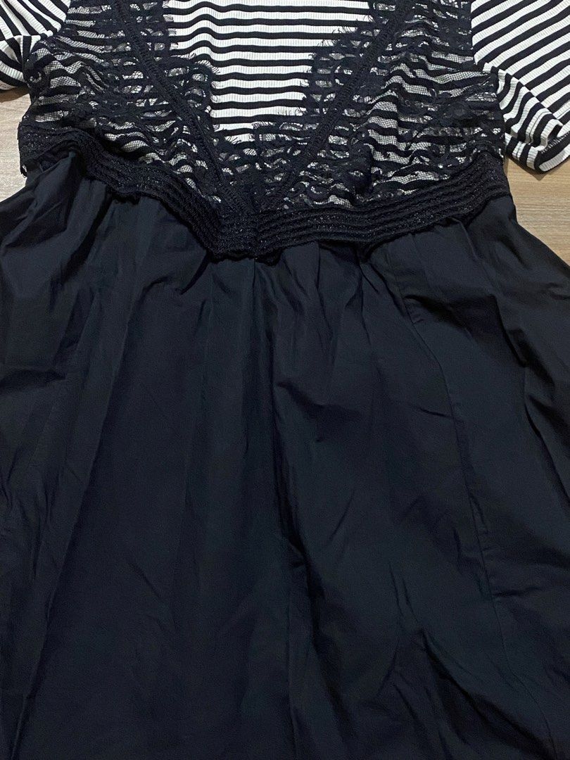 Dress L-semi XL🤍 (Category: Dresses) located in Bulacan. Submitted by Spothings (Listing ID 1466948751, Image 2). Description: Length: 33" With two side pockets Super black in person - Style: Short sleeve dress with slip-on design - Pattern & Design: Black and white stripes on top with a chic black lace V-shape overlay - Skirt: Flared bottom featuring a stitched hem detail - Neckline: Classic crew neck - Material: Lightweight and comfortable fab