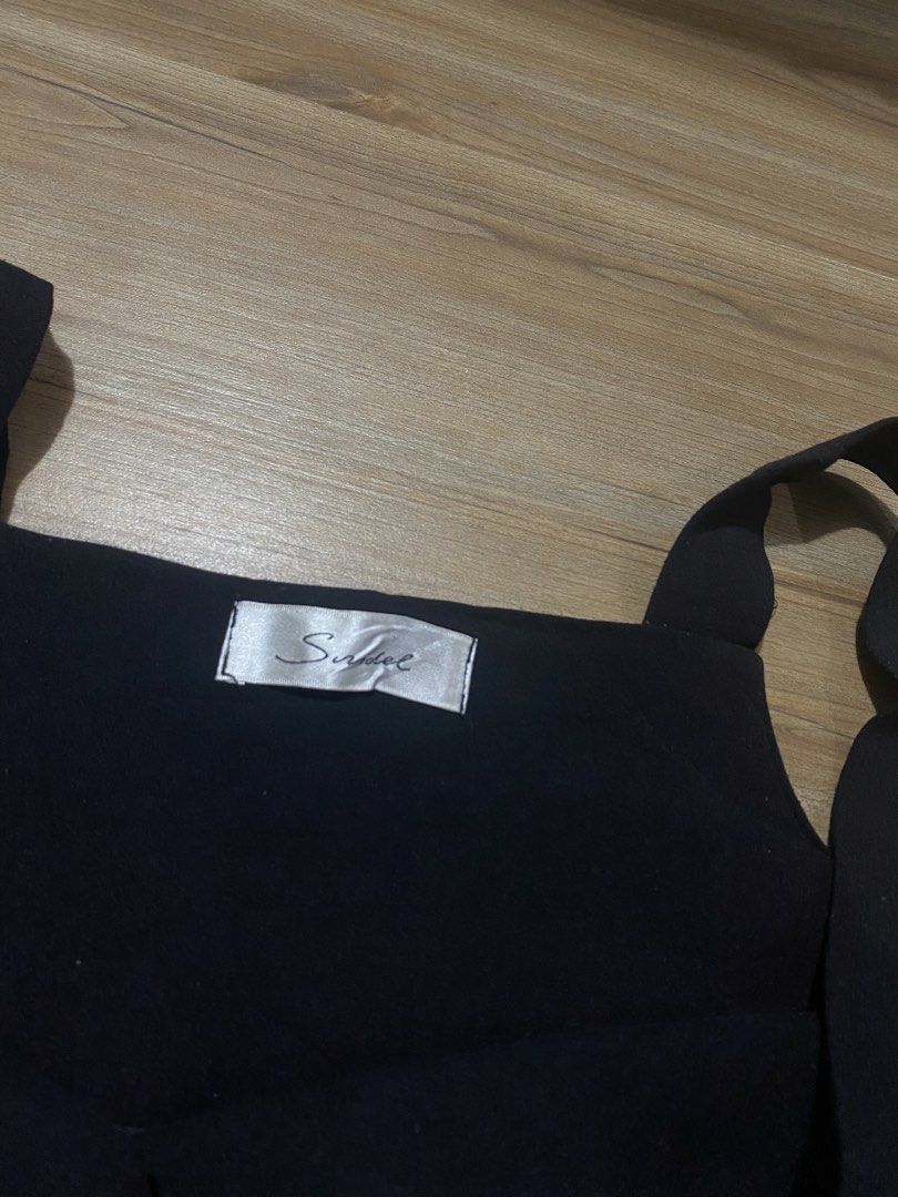 Dress L-XL🤍 (Category: Dresses) located in Bulacan. Submitted by Spothings (Listing ID 1466938794, Image 3). Description: Length: 29" - Brand: Snidel - Color: Classic black - Design: Thick tank straps, square neckline, fitted bodice, and dropped waist with pleated skirt panels - Material: Soft and comfortable fabric with a clean finish - Versatility: Great for casual lakwatsas or layering - Styling: Easily pairs with boots or sneakers.