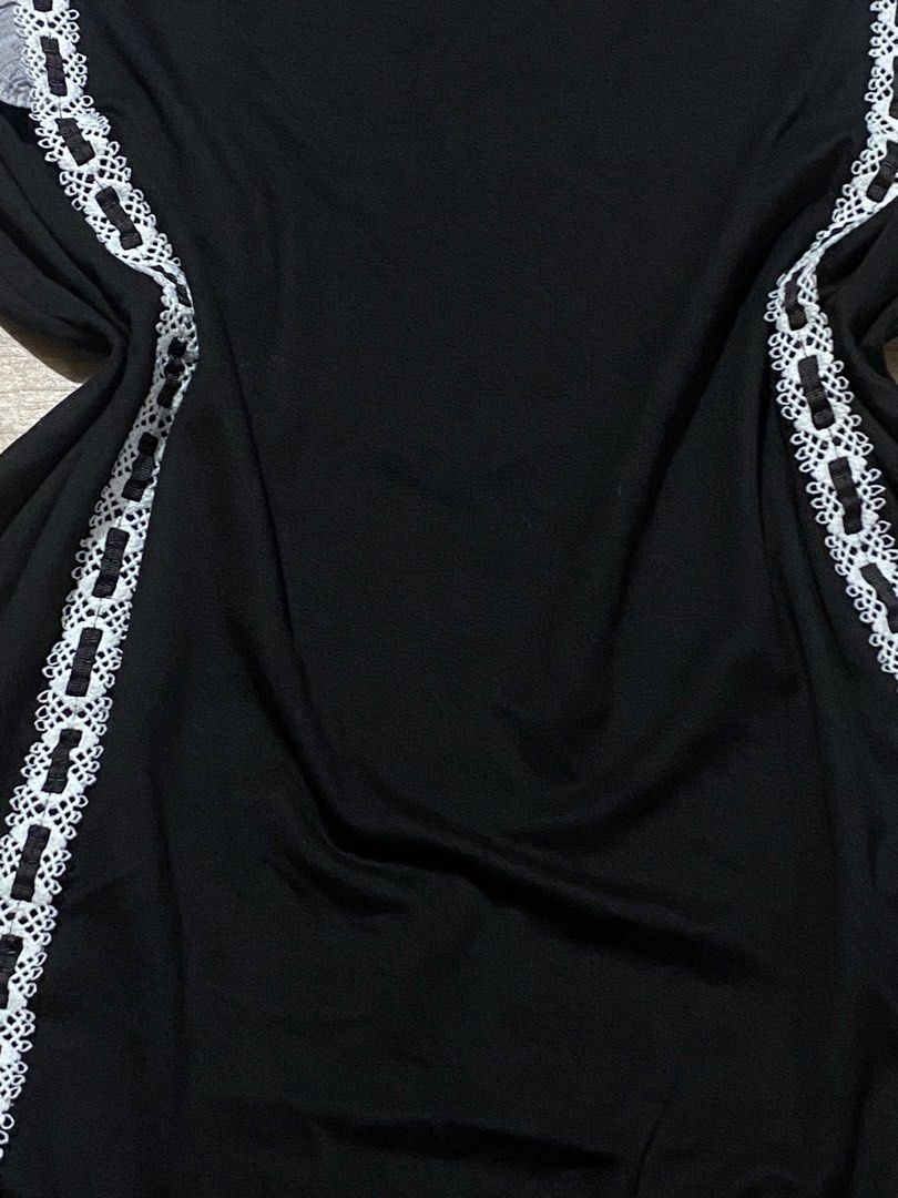 Dress L-XXL🤍super stetch (Category: Dresses) located in Bulacan. Submitted by Spothings (Listing ID 1466942031, Image 2). Description: Length: 34" Super stretchable Super black in person - Color: Black with grey sleeves - Design: Contrast grey textured sleeves and round neckline - Details: Striking white lace trim down the front interwoven with black ribbon - Fit: Relaxed and comfortable - Style: Versatile, easy to dress up or down.