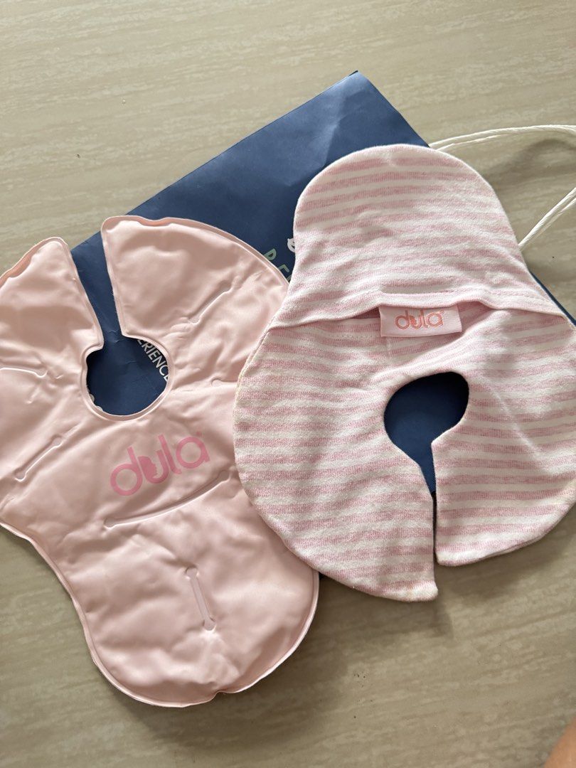 Dula Breastfeeding Hot / Cold Compress Therapack (Category: Maternity Care) located in Antipolo. Submitted by shop__dnce (Listing ID 1466796895, Image 1). Description: - Brand: Dula - Item: Hot and cold breast therapy pack - Color/Design: Pink gel pad with a matching white and pink striped fabric cover - Relief for: Engorgement, plugged ducts, and nursing discomfort - Usage: Microwave for warm therapy or freeze for cold relief - Features: Reusabl
