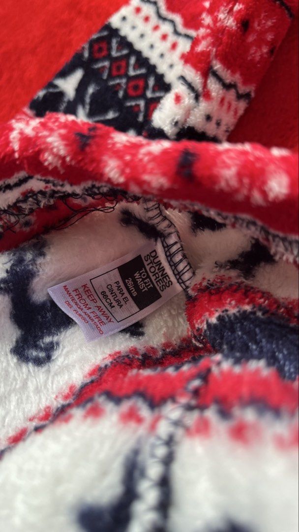 Dunnes Stores Christmas Reindeer Pyjama Set (Category: Undergarments & Loungewear) located in Manila. Submitted by tineemall (Listing ID 1466784607, Image 3). Description: - Brand: Dunnes Stores - Design: Festive navy, white, and red Nordic reindeer print - Material: Super warm and cozy fuzzy fleece - Set includes: Matching long sleeve top and trousers - Sizing: Top fits chest 33-34 inches (84-86 cm), Bottoms fit waist 26 inches (66 cm) - Conditi