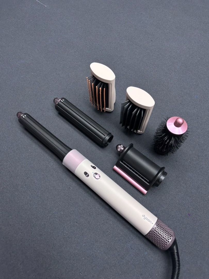 Dyson Airwrap multi-styler complete with attachments HS05 (Category: Hair) located in Las Pinas. Submitted by raremountain-e7fc4f (Listing ID 1466785715, Image 1). Description: - Authentic Dyson Airwrap multi-styler - Eye-catching Ceramic Pop and rose colourway - Includes main handle, styling dryer head, two smoothing brush sizes, round volumizing brush, and curling barrels - Clean bristles and fully intact tips on all attachments - Fully functio