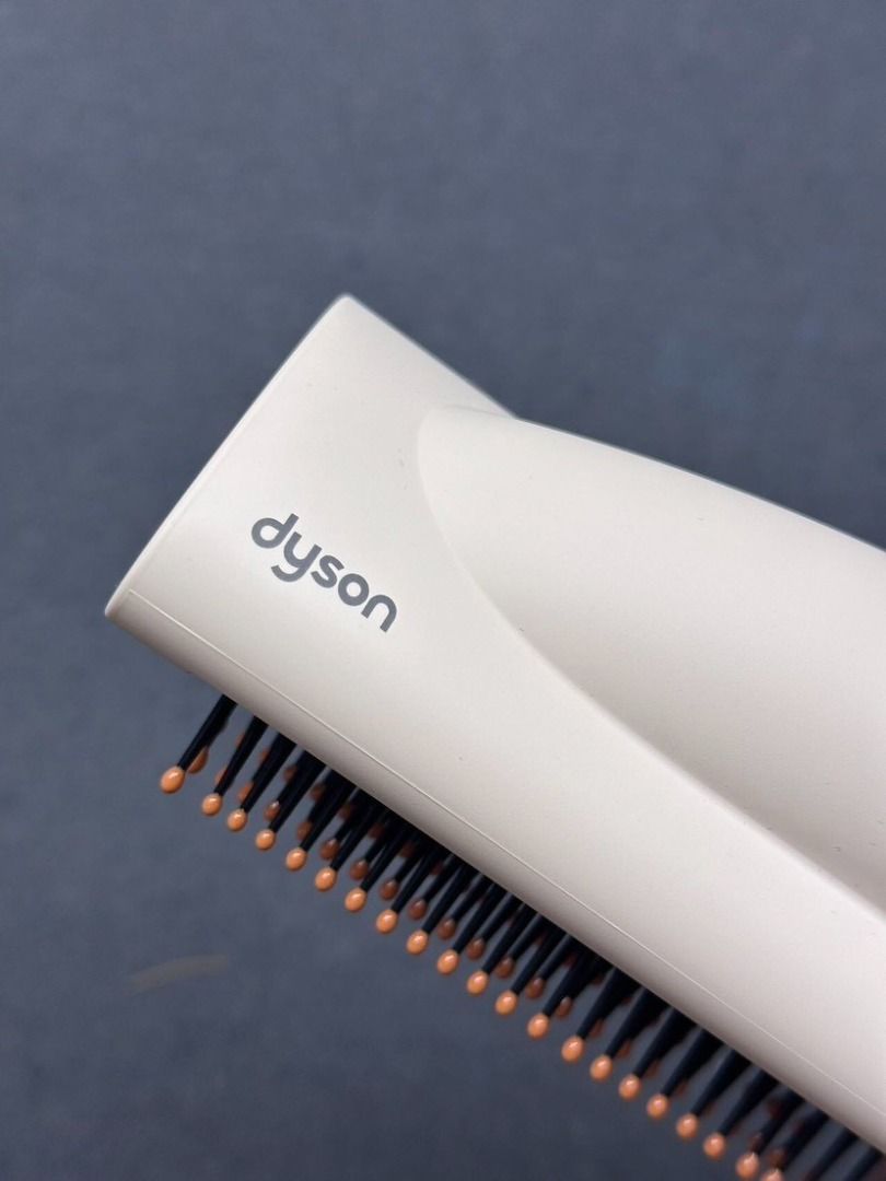 Dyson Airwrap multi-styler complete with attachments HS05 (Category: Hair) located in Las Pinas. Submitted by raremountain-e7fc4f (Listing ID 1466785715, Image 2). Description: - Authentic Dyson Airwrap multi-styler - Eye-catching Ceramic Pop and rose colourway - Includes main handle, styling dryer head, two smoothing brush sizes, round volumizing brush, and curling barrels - Clean bristles and fully intact tips on all attachments - Fully functio