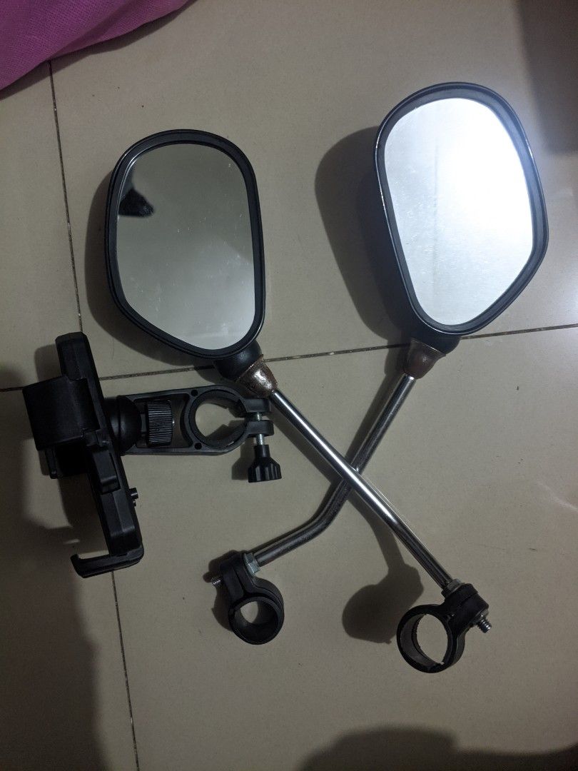 E-Bike assorted accessories (Category: Bicycles) located in Cabuyao City. Submitted by rho.oh.decluts (Listing ID 1466824057, Image 3). Description: - Bundle of essential bicycle gear for commuting and casual riding - Includes 2 rearview mirrors on sturdy metal bars - Features an adjustable phone holder clamp - Comes with rechargeable LED lights (bright white headlight and multi-mode red taillight) - Everything pictured is included in the package