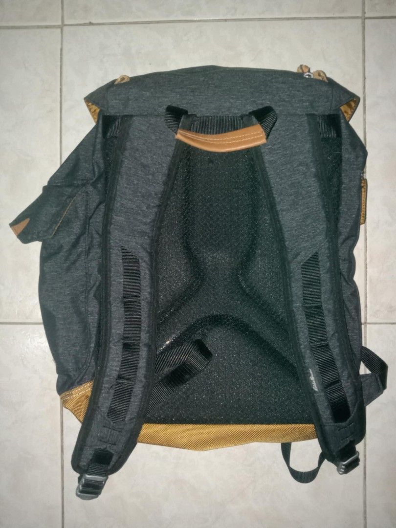 Eddie Bauer Heather Grey and Brown Backpack (Category: Backpacks) located in Manila. Submitted by antonsnchz (Listing ID 1466829380, Image 2). Description: - Brand: Eddie Bauer - Color: Heather grey with brown bottom panel - Closure: Drawstring under main flap with dual buckle straps - Pockets: Front zipper pocket with leather pull tab - Comfort: Padded mesh back panels and adjustable shoulder straps - Condition: Clean interior, sturdy constructi
