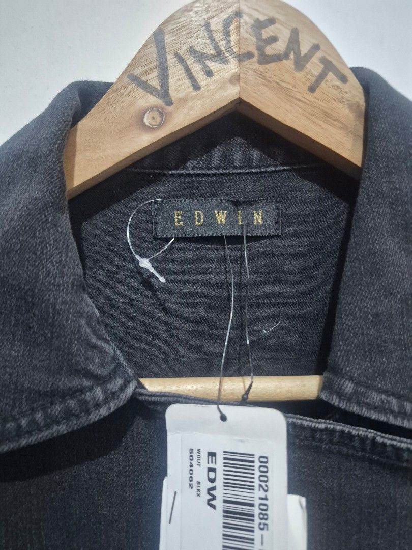 EDWIN Black Denim Biker Vest (Category: Vests) located in Bulacan. Submitted by vince4593 (Listing ID 1466879719, Image 2). Description: - Brand: EDWIN - Size: M - Color: Washed black - Material: Comfortable cotton blend - Design: Heavy zip detailing with an asymmetrical front zipper and multiple zippered pockets - Style: Collared neckline, sleeveless cut - Condition: Brand new with original store price tag still attached.