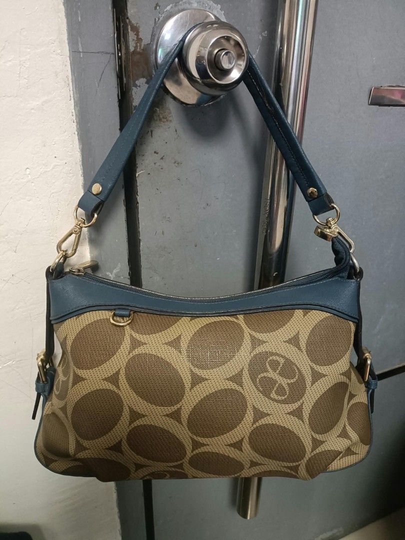 Elegance shoulder/kili bag (Category: Shoulder Bags) located in Manila. Submitted by reneemaygo42069 (Listing ID 1466882364, Image 1). Description: - Stylish brown and beige all-over circle pattern - Contrast blue leather trim on top zipper and handles - Elegant gold-tone hardware strap clips - Secure top zipper closure - Compact and lightweight, ideal for daily use 👜✨ Preloved Bags for Sale! ✨ Decluttering my bags as I’m mostly using mommy bags