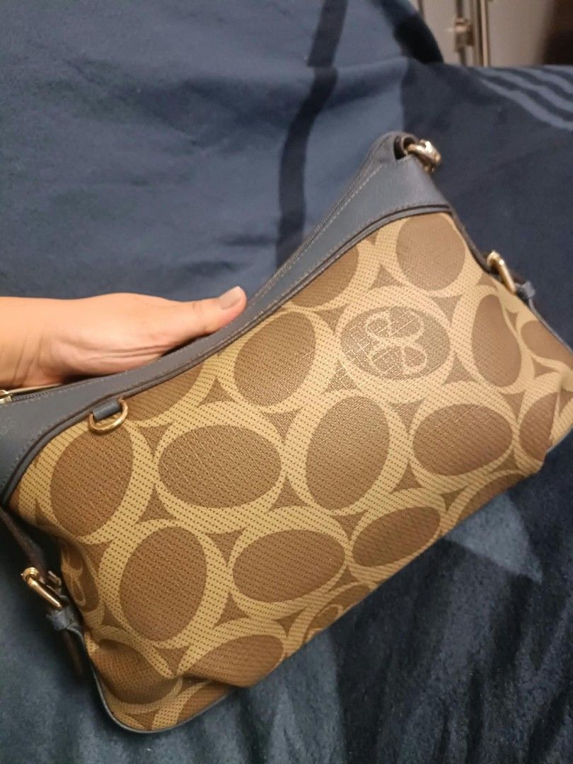 Elegance shoulder/kili bag (Category: Shoulder Bags) located in Manila. Submitted by reneemaygo42069 (Listing ID 1466882364, Image 3). Description: - Stylish brown and beige all-over circle pattern - Contrast blue leather trim on top zipper and handles - Elegant gold-tone hardware strap clips - Secure top zipper closure - Compact and lightweight, ideal for daily use 👜✨ Preloved Bags for Sale! ✨ Decluttering my bags as I’m mostly using mommy bags