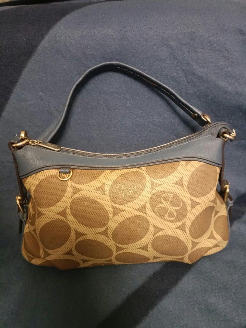 Elegance shoulder/kili bag (Category: Shoulder Bags) located in Manila. Submitted by reneemaygo42069 (Listing ID 1466882364, Image 2). Description: - Stylish brown and beige all-over circle pattern - Contrast blue leather trim on top zipper and handles - Elegant gold-tone hardware strap clips - Secure top zipper closure - Compact and lightweight, ideal for daily use 👜✨ Preloved Bags for Sale! ✨ Decluttering my bags as I’m mostly using mommy bags