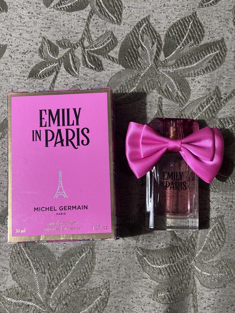 Emily in Paris Michel Germain Eau de Parfum 30ml (Category: Fragrance & Deodorants) located in Manila. Submitted by pochieee2916 (Listing ID 1466893924, Image 1). Description: - Item: Michel Germain Emily in Paris Eau de Parfum - Size: 30 ml / 1.0 fl. oz. - Condition: Brand new, unused (box opened for photos only) - Packaging: Includes original vibrant pink and plaid box with cute neck ribbon - Authentic and ready to ship.