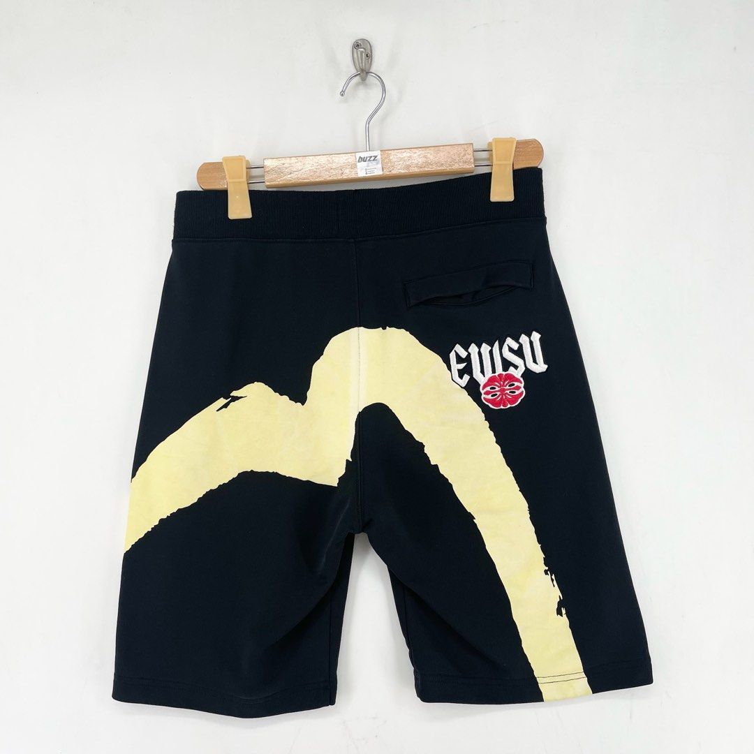 Evisu Big Logo Daicock Sweat Shorts (Category: Shorts) located in Manila. Submitted by buzz.garments (Listing ID 1466932198, Image 1). Description: Size: Medium on tag Dimensions(inches) - Waist/Width: 31”-38” (Strechable) - Hip: 20” - Front Rise: 14” - Thigh: 11” - Inseam: 8” - Outseam/Length : 21” - Leg Opening: 10 - color may vary due to lighting. please manage your expectations-minimal and unseen flaws must be considered..