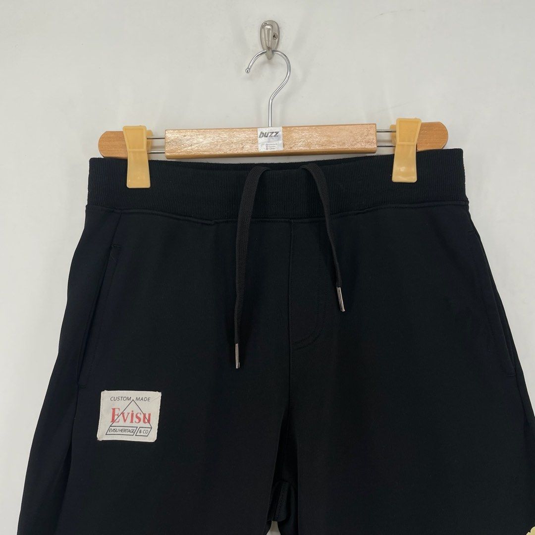 Evisu Big Logo Daicock Sweat Shorts (Category: Shorts) located in Manila. Submitted by buzz.garments (Listing ID 1466932198, Image 3). Description: Size: Medium on tag Dimensions(inches) - Waist/Width: 31”-38” (Strechable) - Hip: 20” - Front Rise: 14” - Thigh: 11” - Inseam: 8” - Outseam/Length : 21” - Leg Opening: 10 - color may vary due to lighting. please manage your expectations-minimal and unseen flaws must be considered..