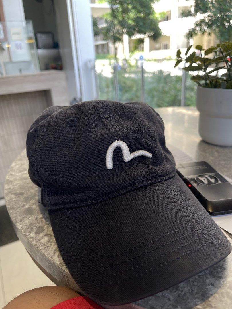 Evisu Black Baseball Cap with White Seagull Embroidery (Category: Caps & Hats) located in Manila. Submitted by poorstazy (Listing ID 1466810116, Image 1). Description: - Brand: Evisu Osaka - Color: Black - Material: 100% Cotton - Design: Iconic white seagull embroidery on front, Evisu branding on back strap - Fit: Classic 6-panel construction with metal eyelets, fits size 57-59cm - Condition: Excellent pre-loved (Ready to wear) - Mode of Payment: