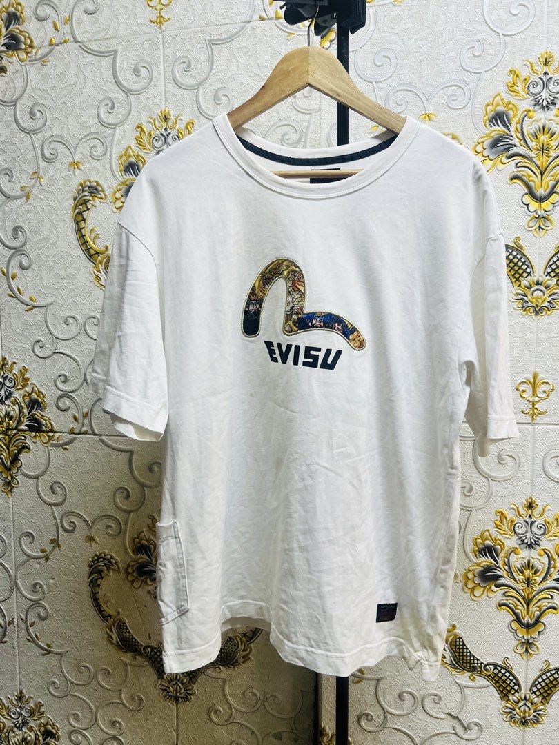 Evisu Heritage Graphic White T-Shirt (Category: Tshirts & Polo Shirts ) located in Manila. Submitted by irenekaren57943 (Listing ID 1466847585, Image 1). Description: 𒊹︎𝐄𝐕𝐈𝐒𝐔 𝐒𝐡𝐢𝐫𝐭 ➤ 𝟐𝟑 𝐖 | 𝟐𝟗 𝐋 ➤ 𝐋𝐢𝐤𝐞 𝐍𝐞𝐰 ➤ 𝐍𝐨 𝐈𝐬𝐬𝐮𝐞 𝐖𝐚𝐬𝐡𝐚𝐛𝐥𝐞 𝐒𝐭𝐚𝐢𝐧‼️ .