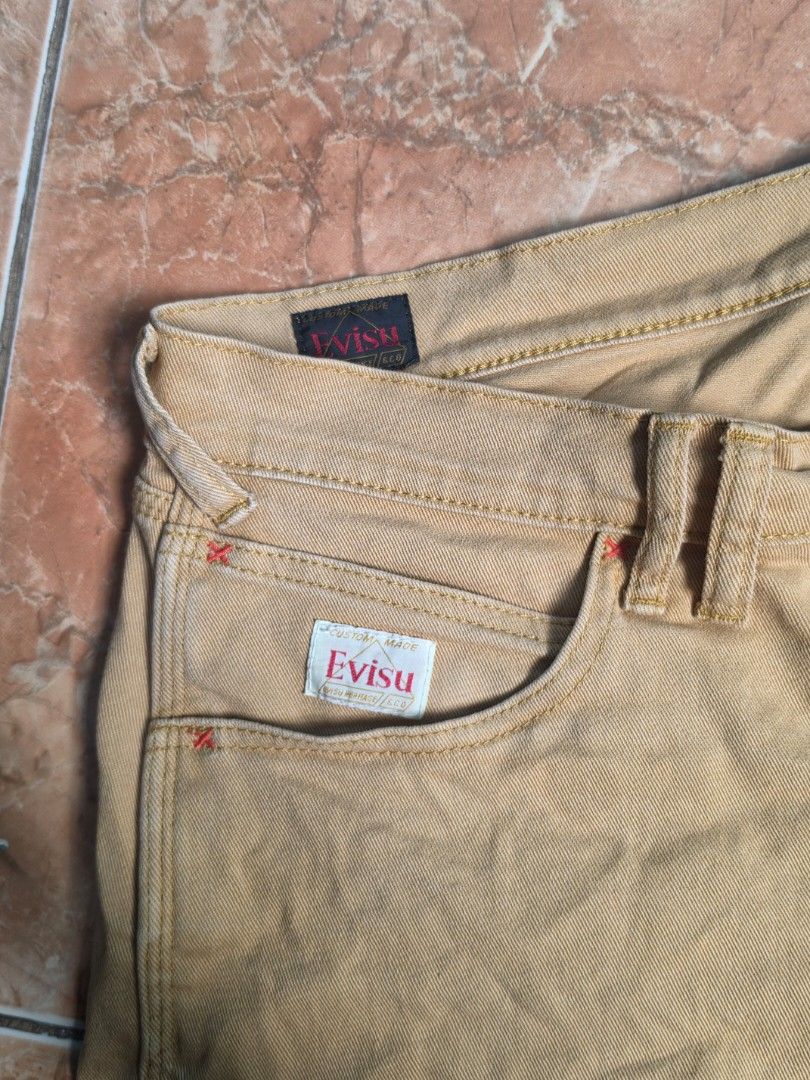 Evisu Tan Cargo Shorts Size 34 (Category: Shorts) located in Quezon City. Submitted by mallio112 (Listing ID 1466884606, Image 3). Description: Evisu tan utility shorts in size 34. Made from 99% cotton and 1% spandex blend for stretch and comfort. Classic Evisu branding tags on front and back pockets. .