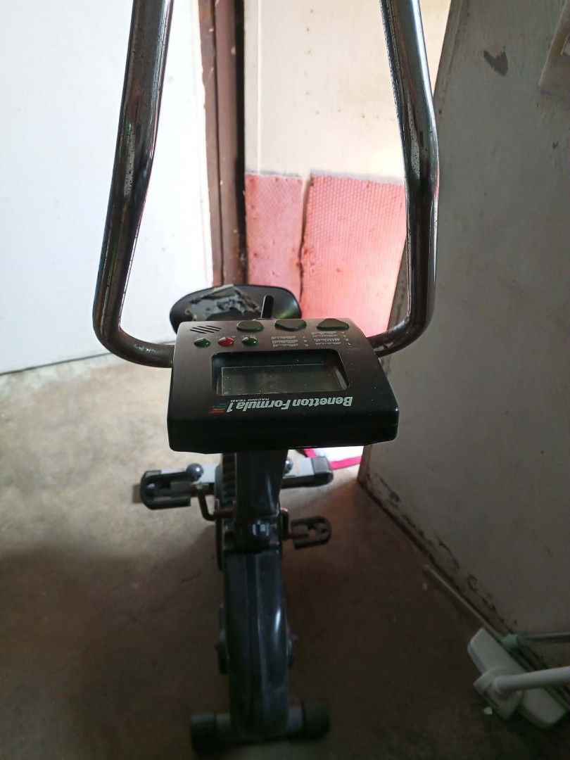 Exercise Bike (Category: Cardio & Fitness Machines) located in Taguig. Submitted by quinn_jhom29 (Listing ID 1466868922, Image 2). Description: - Authentic Benetton Formula 1 stationary exercise bike - Built-in digital monitor on handlebars to track your workout progress - Adjustable resistance to suit your fitness level - Pedals and internal mechanics function normally and smoothly - Cosmetically: Seat cushion is heavily torn on the left side (n